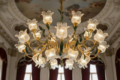 Gold chandelier with floral design in a room with curtains

