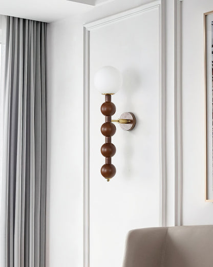 Selene Kugelwandleuchte mit Nussbaum-Perlmuttdesign und warmem Licht