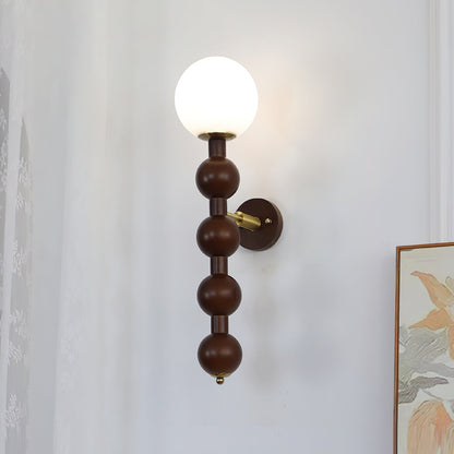 Selene Kugelwandleuchte mit Nussbaum-Perlmuttdesign und warmem Licht