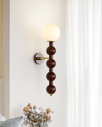 Selene Kugelwandleuchte mit Nussbaum-Perlmuttdesign und warmem Licht